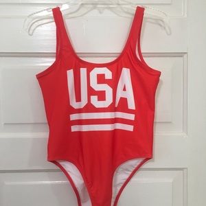 USA one-piece swimsuit with scoop back. Never worn